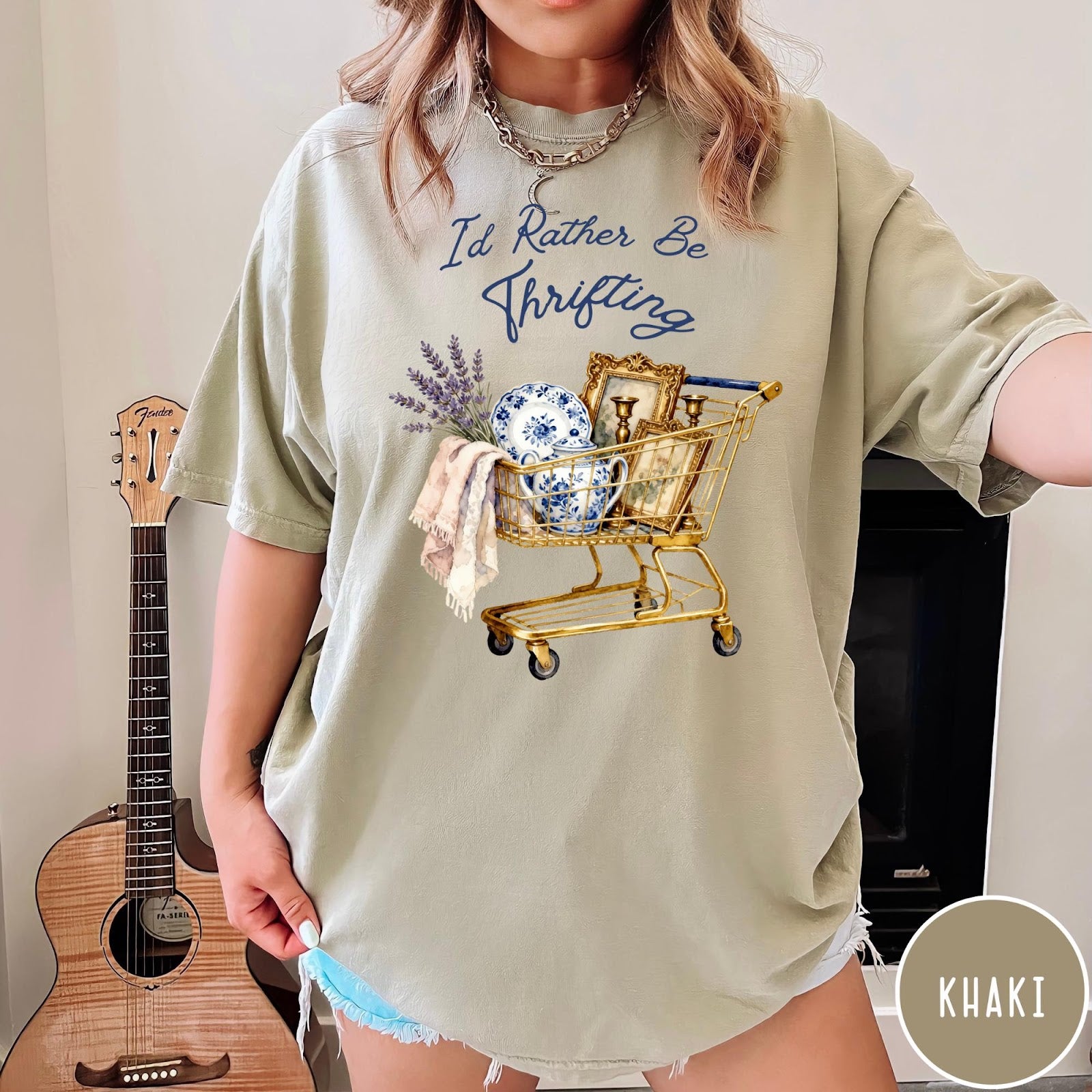 Comfort Colors tee in Khaki featuring vintage decor graphic of a shopping cart filled with thrifted items