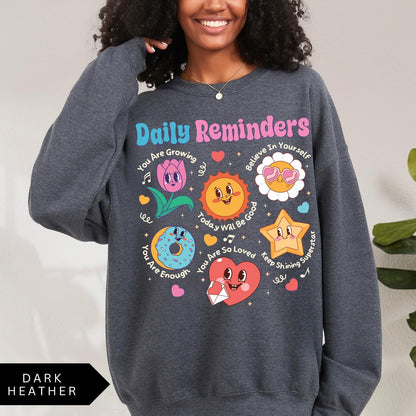Comfort Colors tee in Dark Heather featuring retro mascot design with daily affirmations and colorful graphics