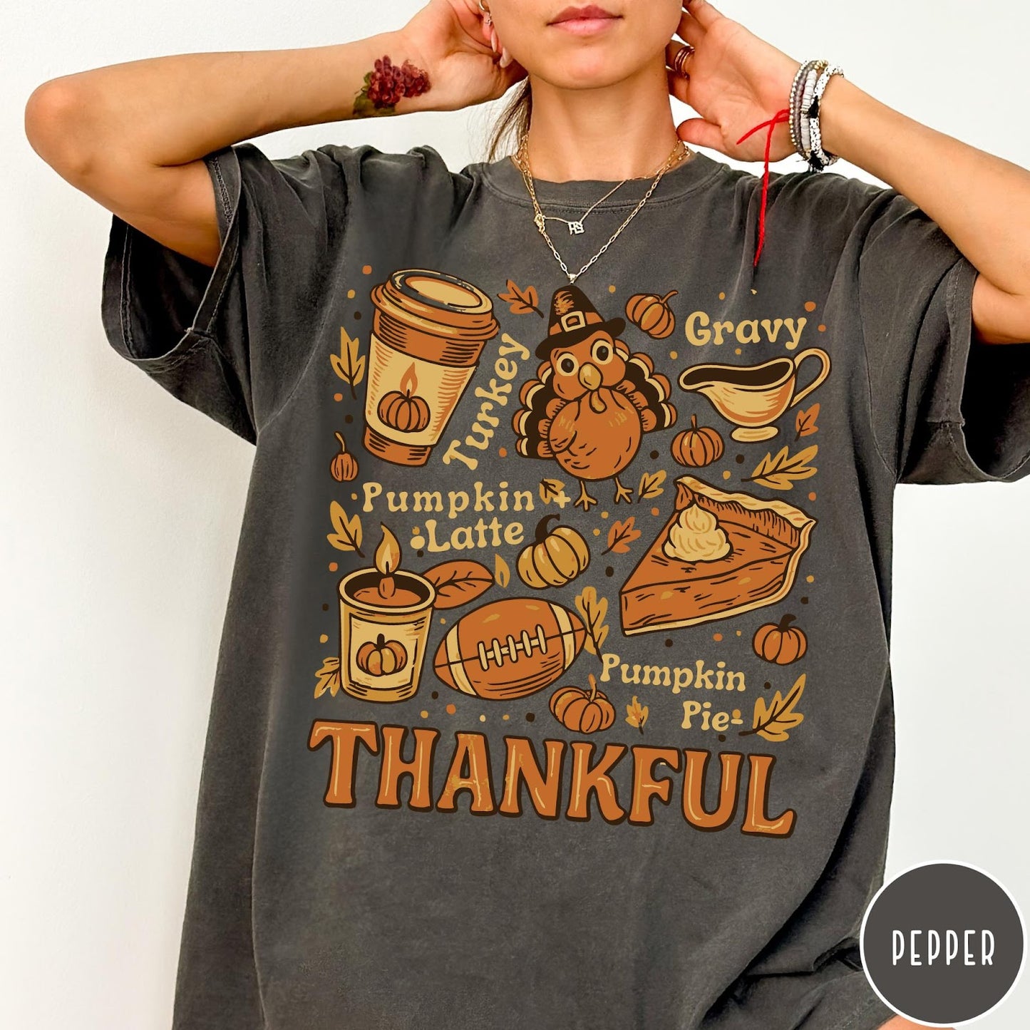 Comfort Colors tee in Pepper featuring retro Thanksgiving dinner items including turkey, pumpkin latte, and pumpkin pie graphic