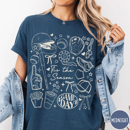 Comfort Colors tee in Midnight featuring baseball game day graphic with helmet, bat, ball, and snacks.