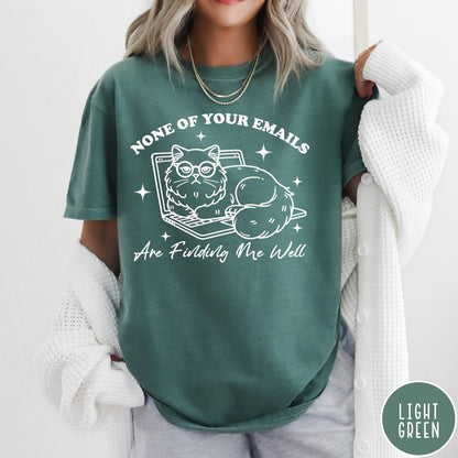 Comfort Colors tee in Light Green featuring white line art of a grumpy cat wearing glasses on a laptop
