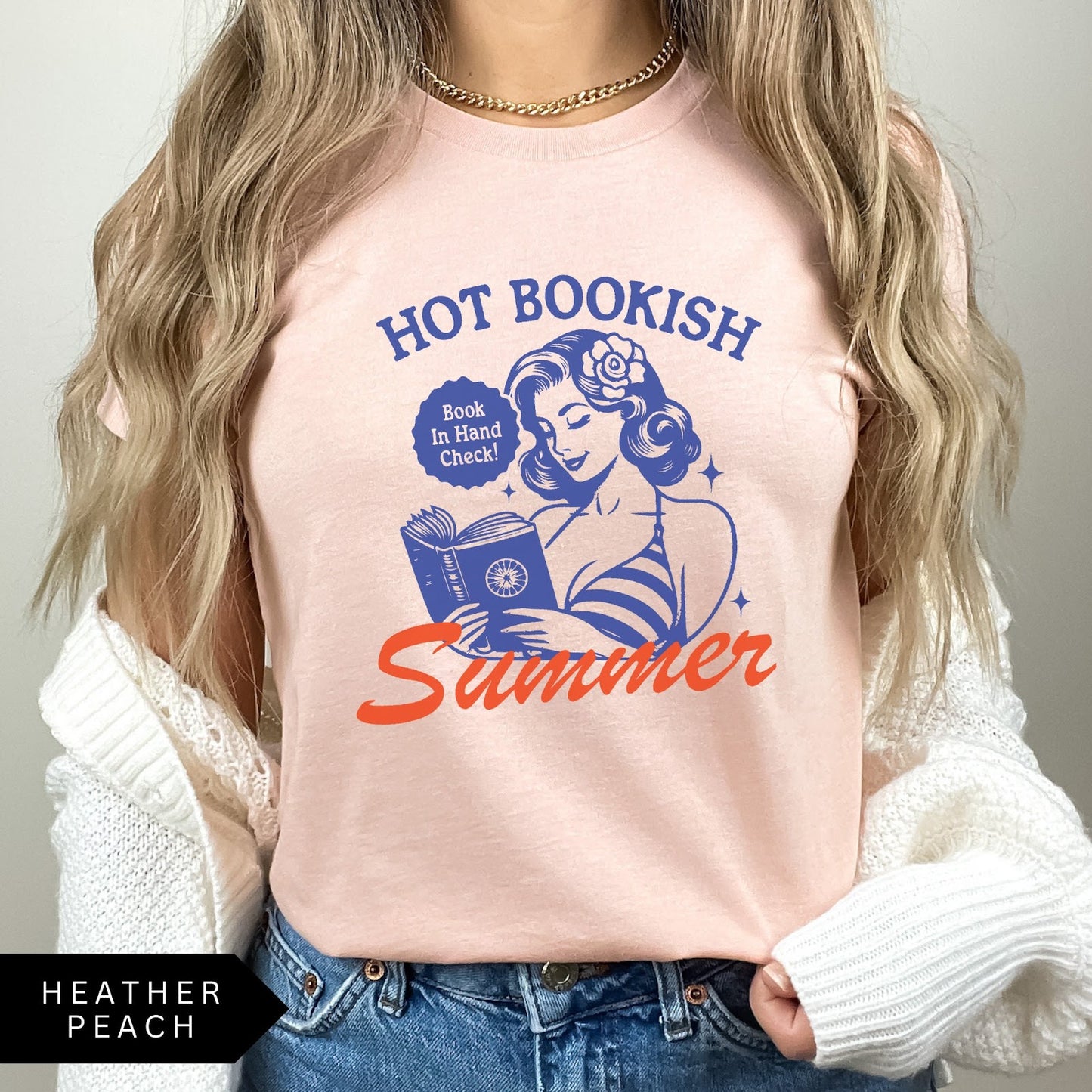 Comfort Colors tee in Heather Peach featuring pinup girl reading a book graphic design with blue and orange ink