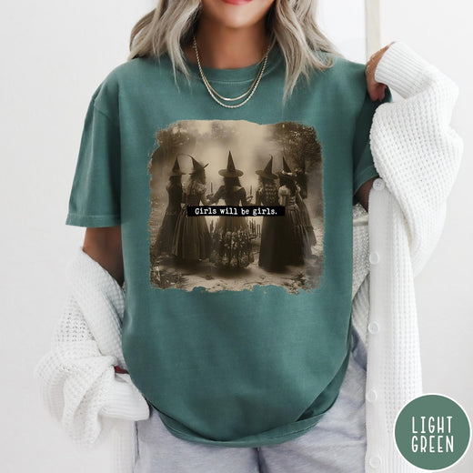 Comfort Colors tee in Light Green featuring vintage style graphic of five witches standing in a circle together