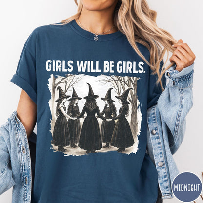 Comfort Colors tee in Midnight featuring vintage style graphic of five witches holding hands in a circle