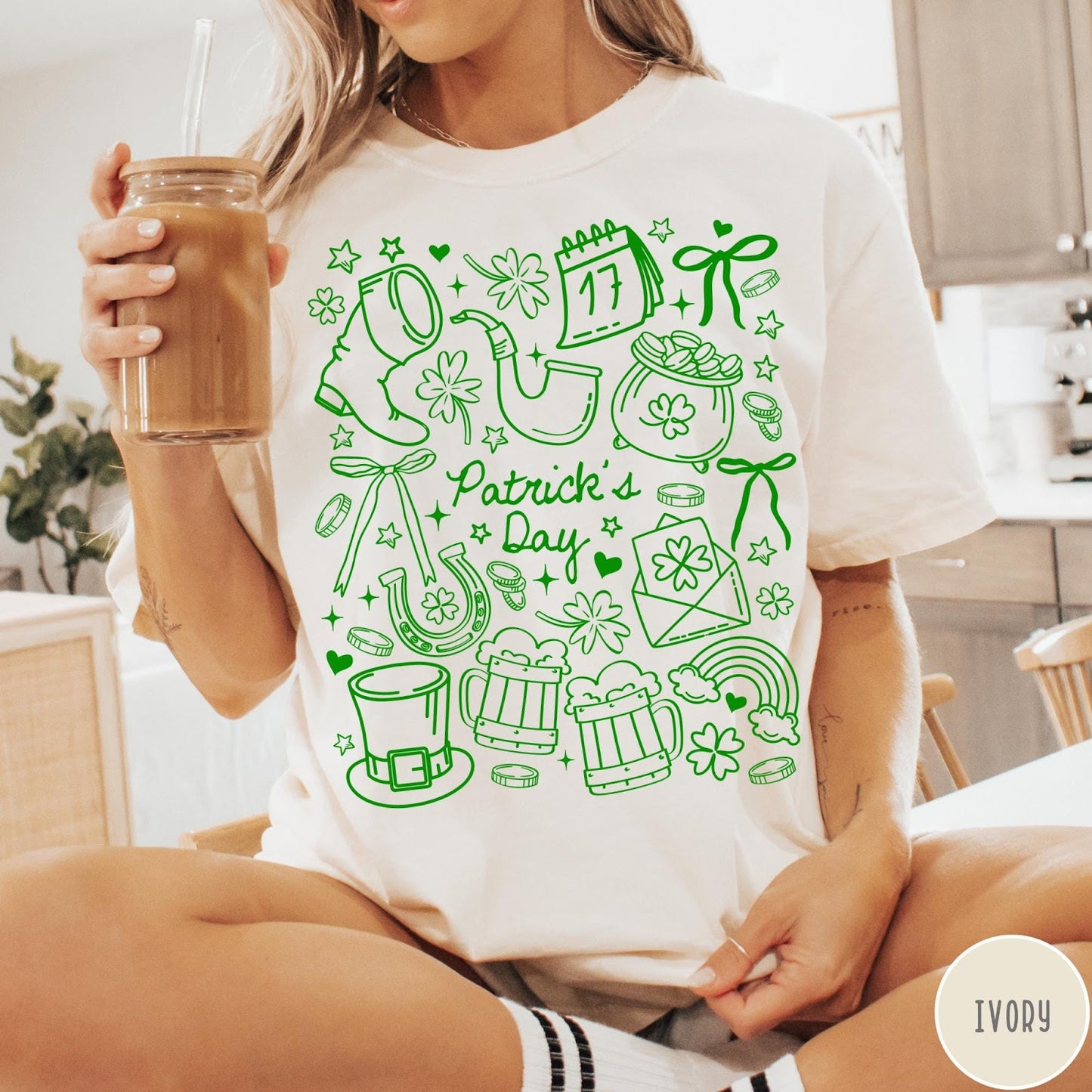 Comfort Colors tee in Ivory featuring line art style St. Patrick's Day icons and symbols