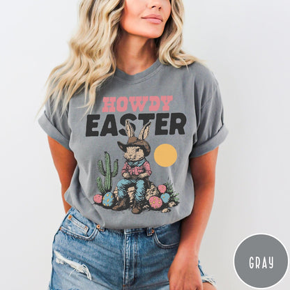 Comfort Colors tee in Gray featuring western graphic of a cowboy bunny sitting with cactus and eggs