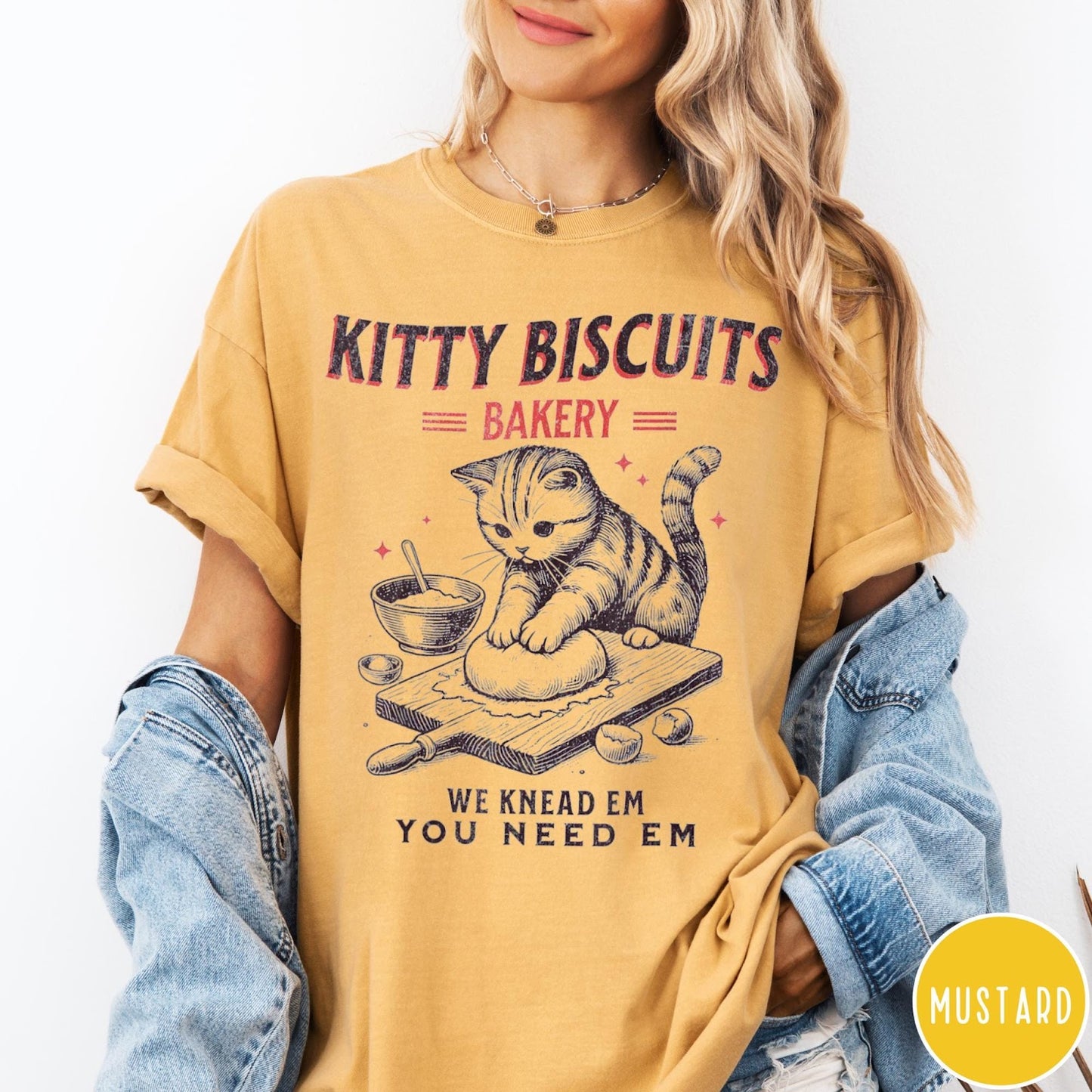Comfort Colors tee in Mustard featuring vintage style graphic of a cat baking biscuits on board
