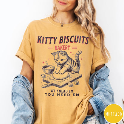 Comfort Colors tee in Mustard featuring vintage style graphic of a cat baking biscuits on board