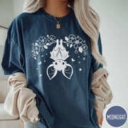 Comfort Colors tee in Midnight featuring line art style upside down bat graphic with surrounding floral elements