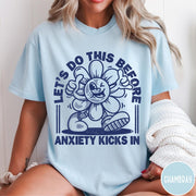 Comfort Colors tee in Chambray featuring retro graphic style winking flower character with anxiety text design