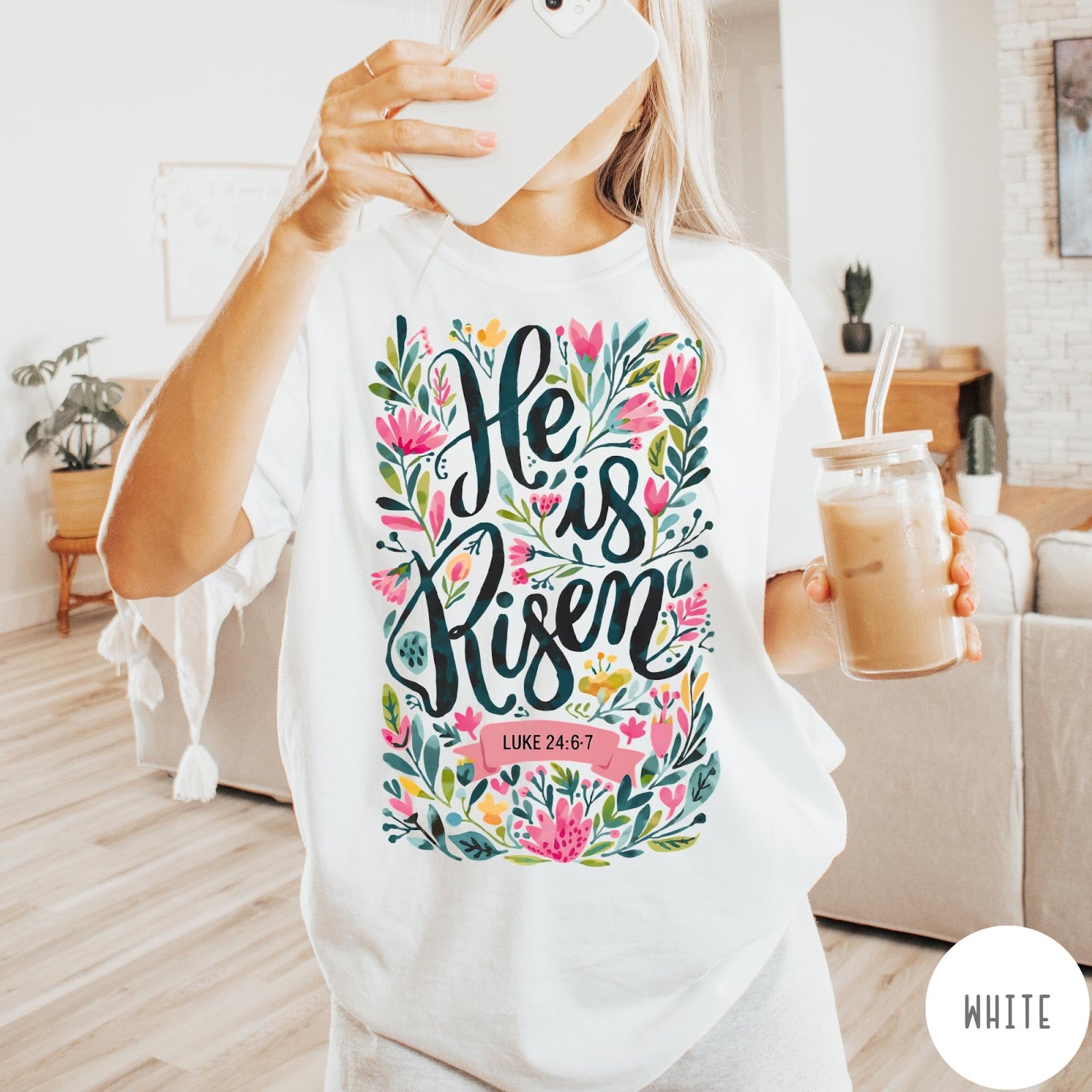 Comfort Colors tee in White featuring religious floral design with He is Risen text graphic