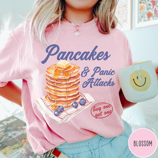 Comfort Colors tee in Blossom featuring watercolor style graphic of a stack of pancakes with blueberries and syrup