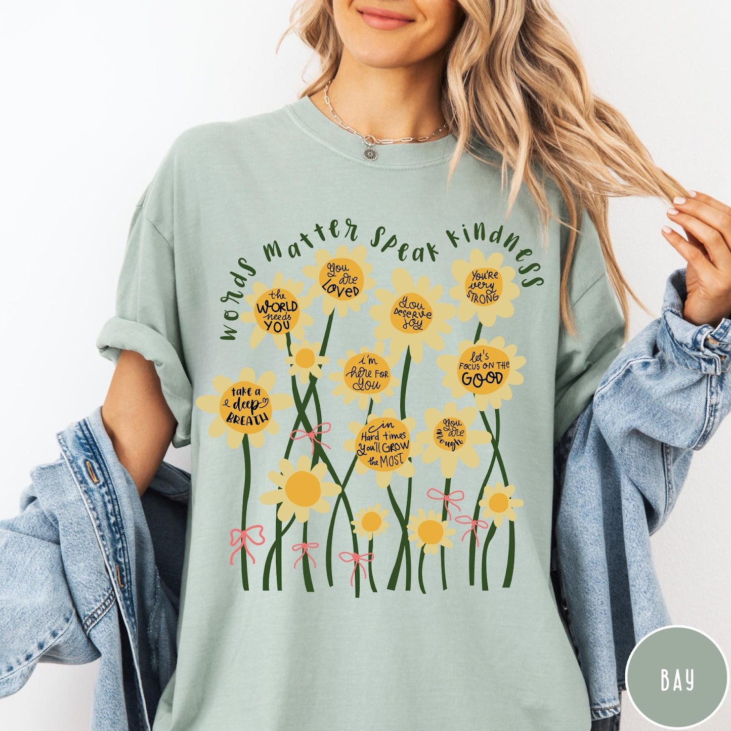 Comfort Colors tee in Bay featuring daisy graphic with positive affirmations and encouraging words about kindness