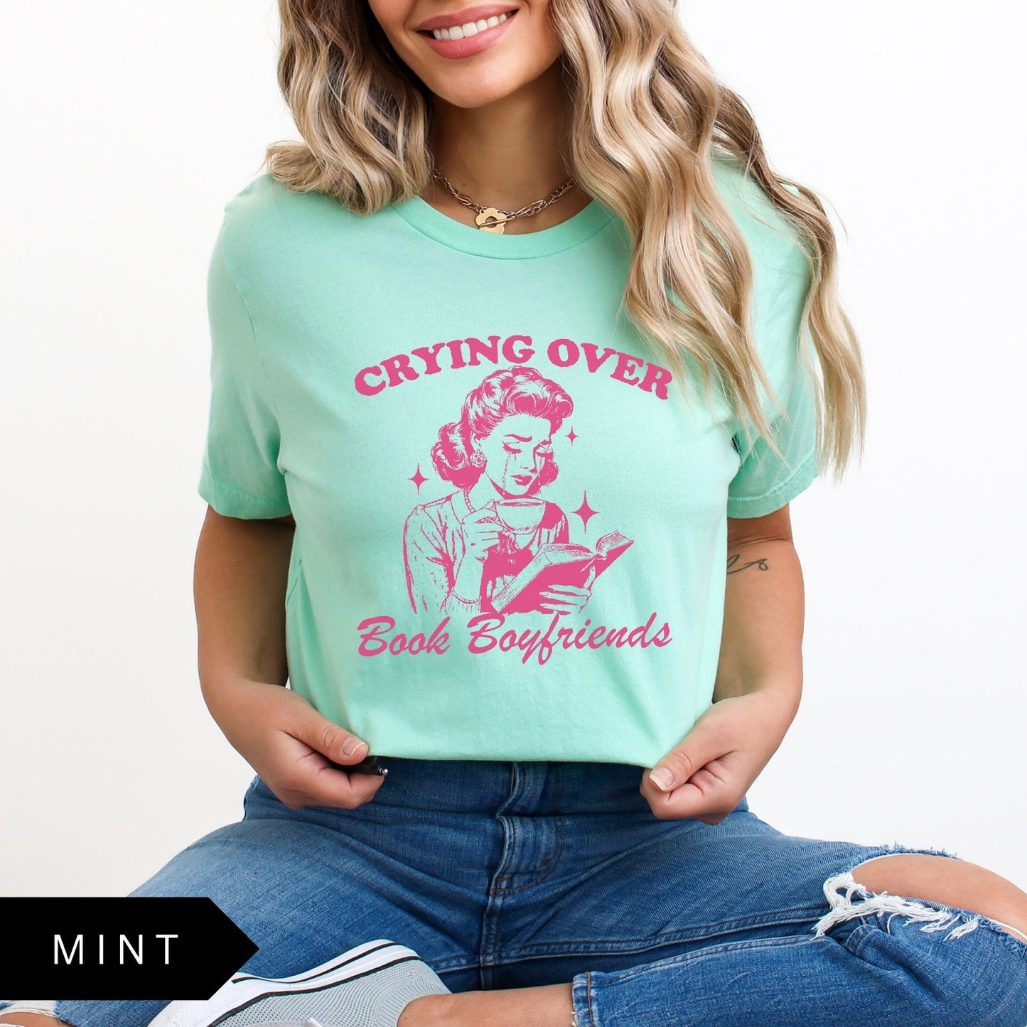 Comfort Colors tee in Mint featuring retro style graphic of a woman crying while reading a book