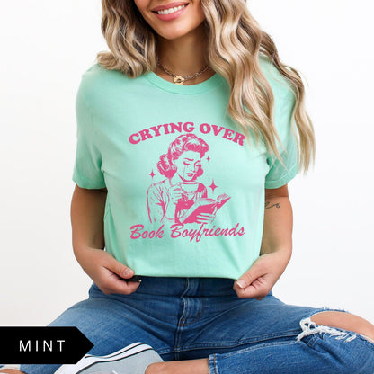 Comfort Colors tee in Mint featuring retro style graphic of a woman crying while reading a book