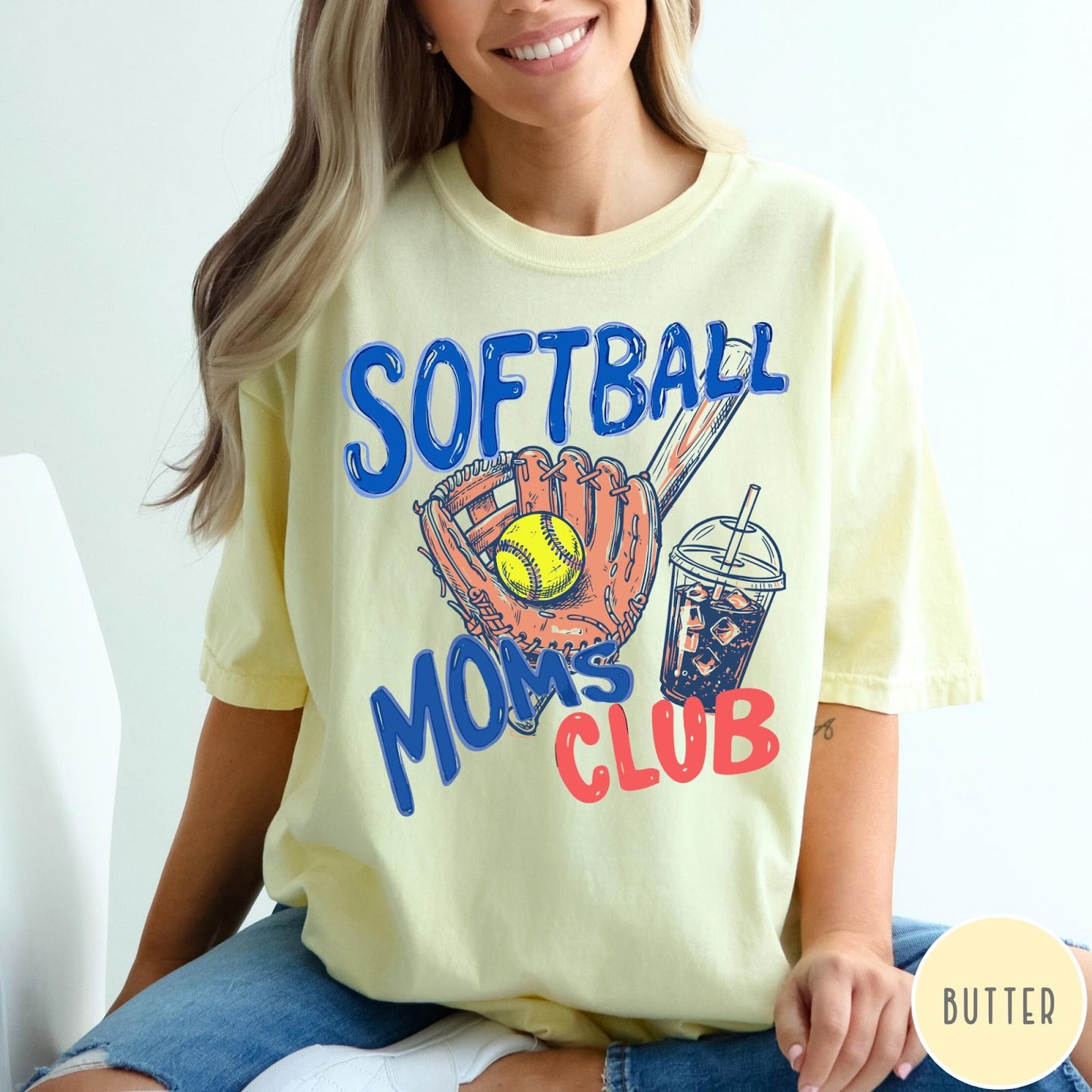 Comfort Colors tee in Butter featuring softball mom life graphic with baseball glove, ball, and iced coffee