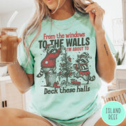 Comfort Colors tee in Island Reef featuring festive raccoon graphic with holiday lights and Christmas tree design.