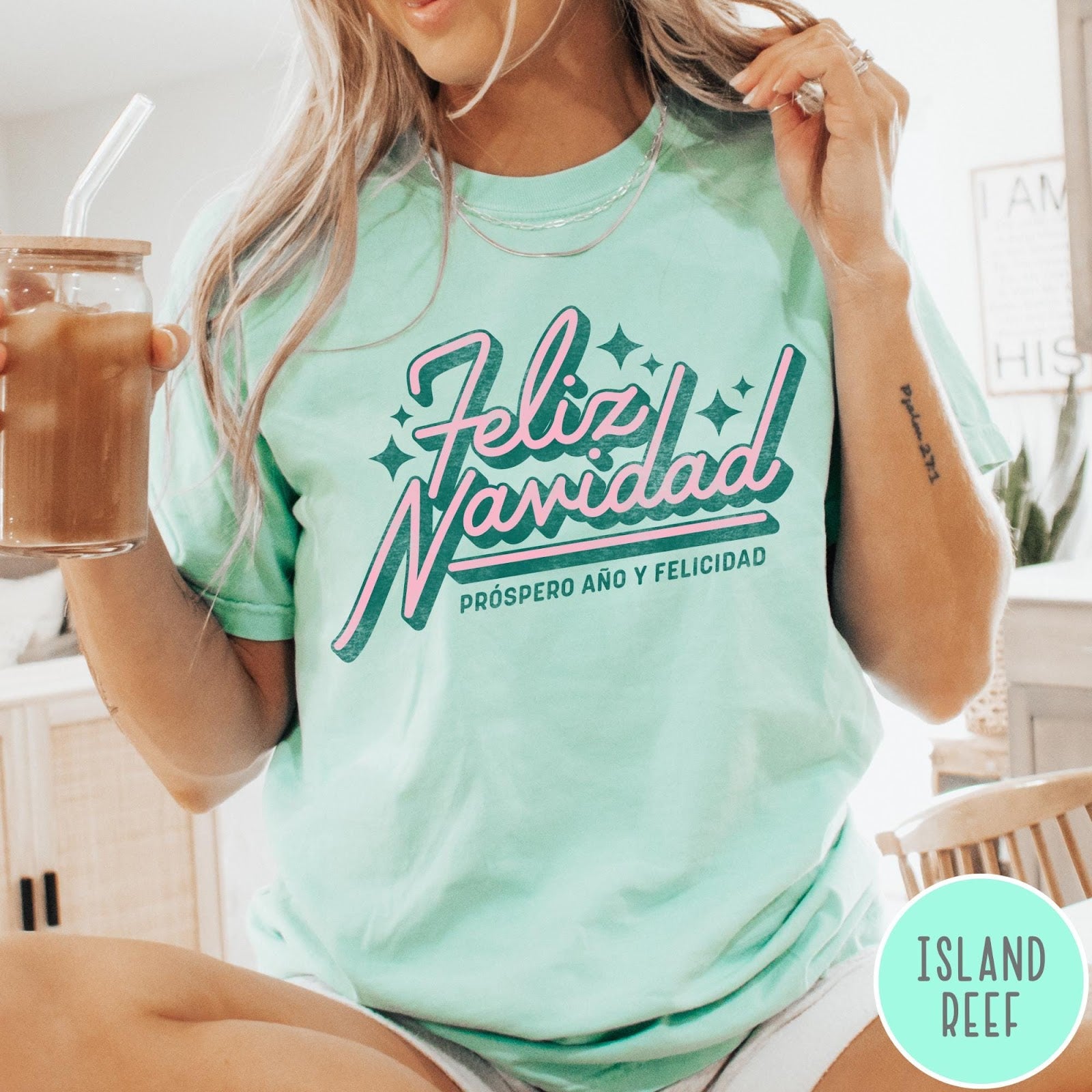 Comfort Colors tee in Island Reef featuring retro Christmas style Feliz Navidad greeting with stars and holiday text