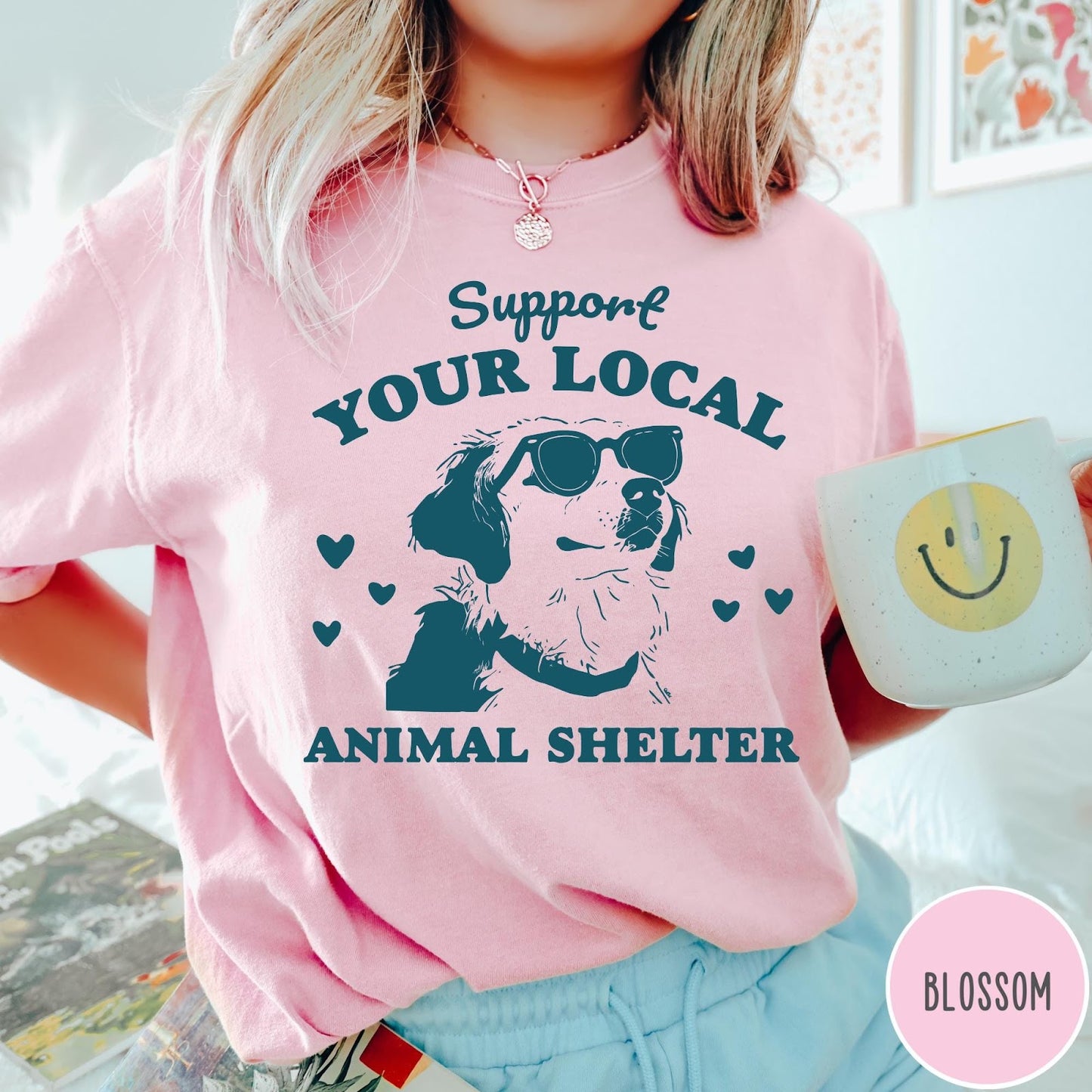 Comfort Colors tee in Blossom featuring graphic illustration of a dog wearing sunglasses and surrounding small hearts