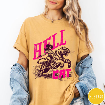 Comfort Colors tee in Mustard featuring retro design of a cowgirl riding a tiger with pink text