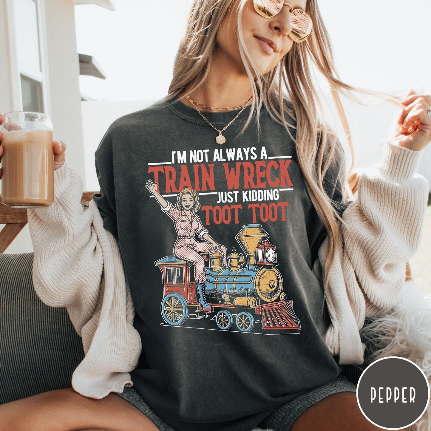 Comfort Colors tee in Pepper featuring vintage style pin-up woman sitting on a steam train graphic