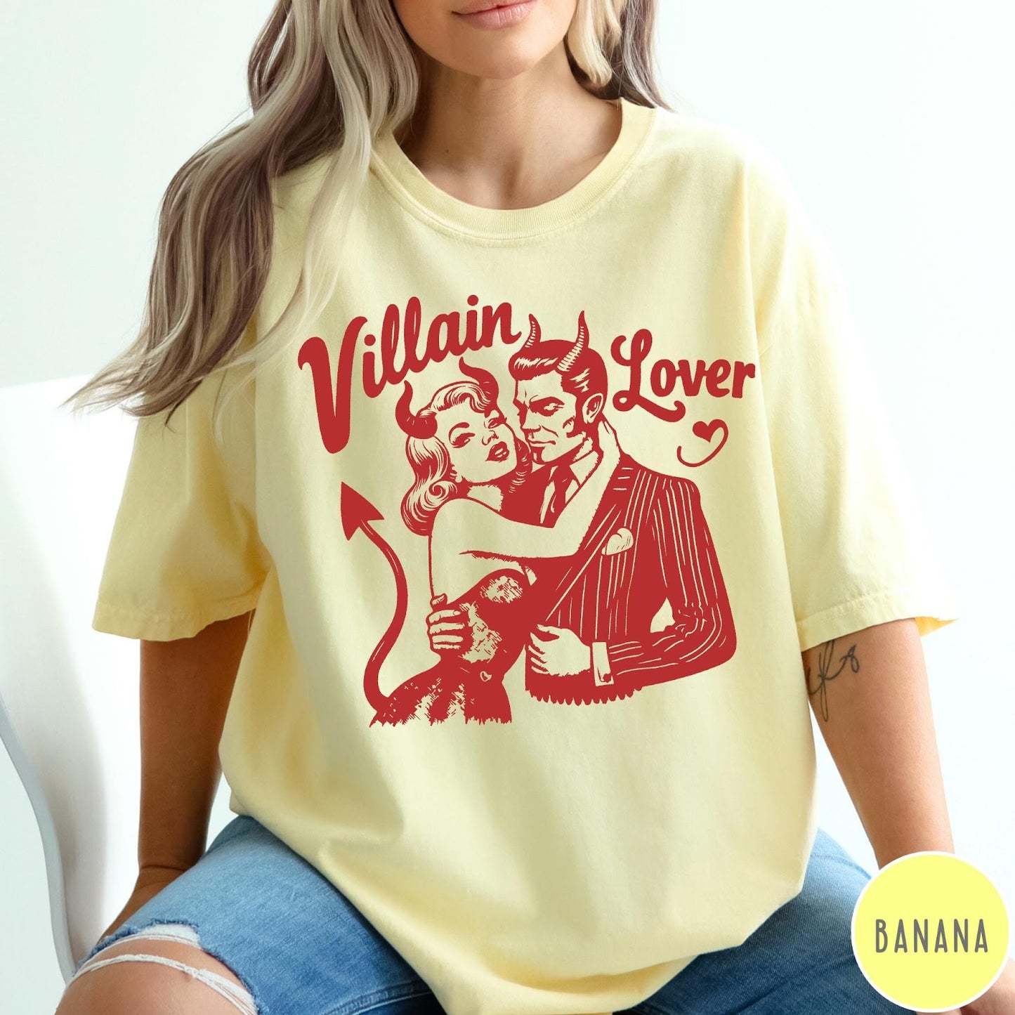 Comfort Colors tee in Banana featuring vintage style graphic of a devilish couple embracing each other