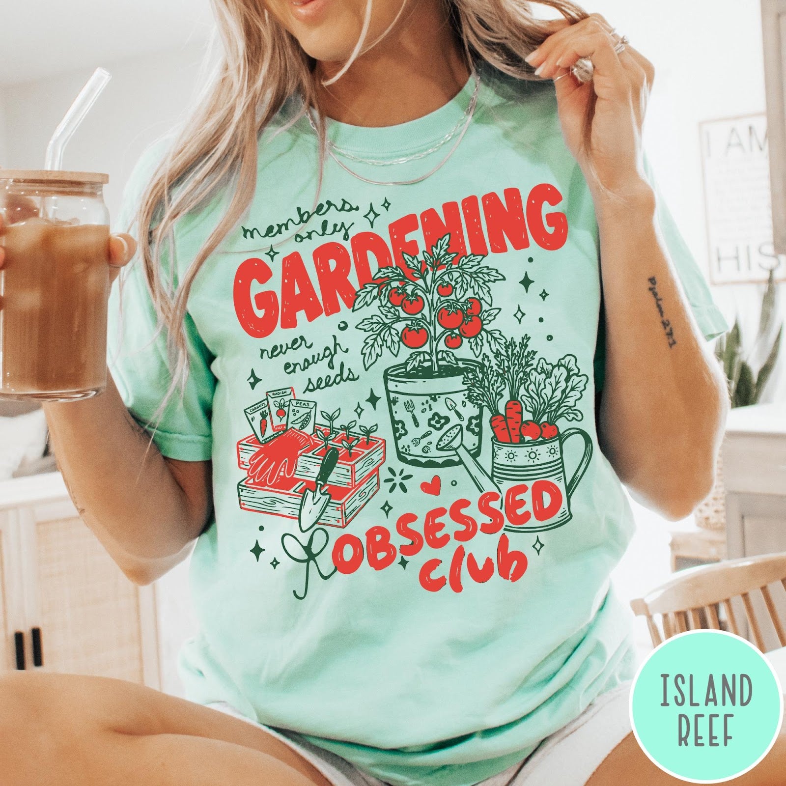 Comfort Colors tee in Island Reef featuring retro graphic gardening design with tomato plant, seeds, and gardening tools