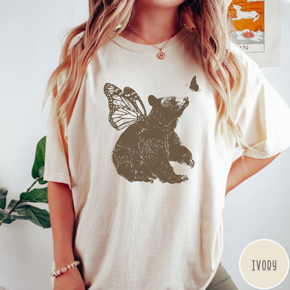 Comfort Colors tee in Ivory featuring vintage style graphic of a bear with butterfly wings and butterfly