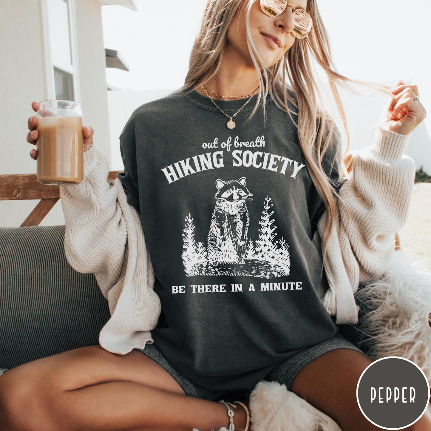 Comfort Colors tee in Pepper featuring outdoor style graphic of a raccoon standing in the forest