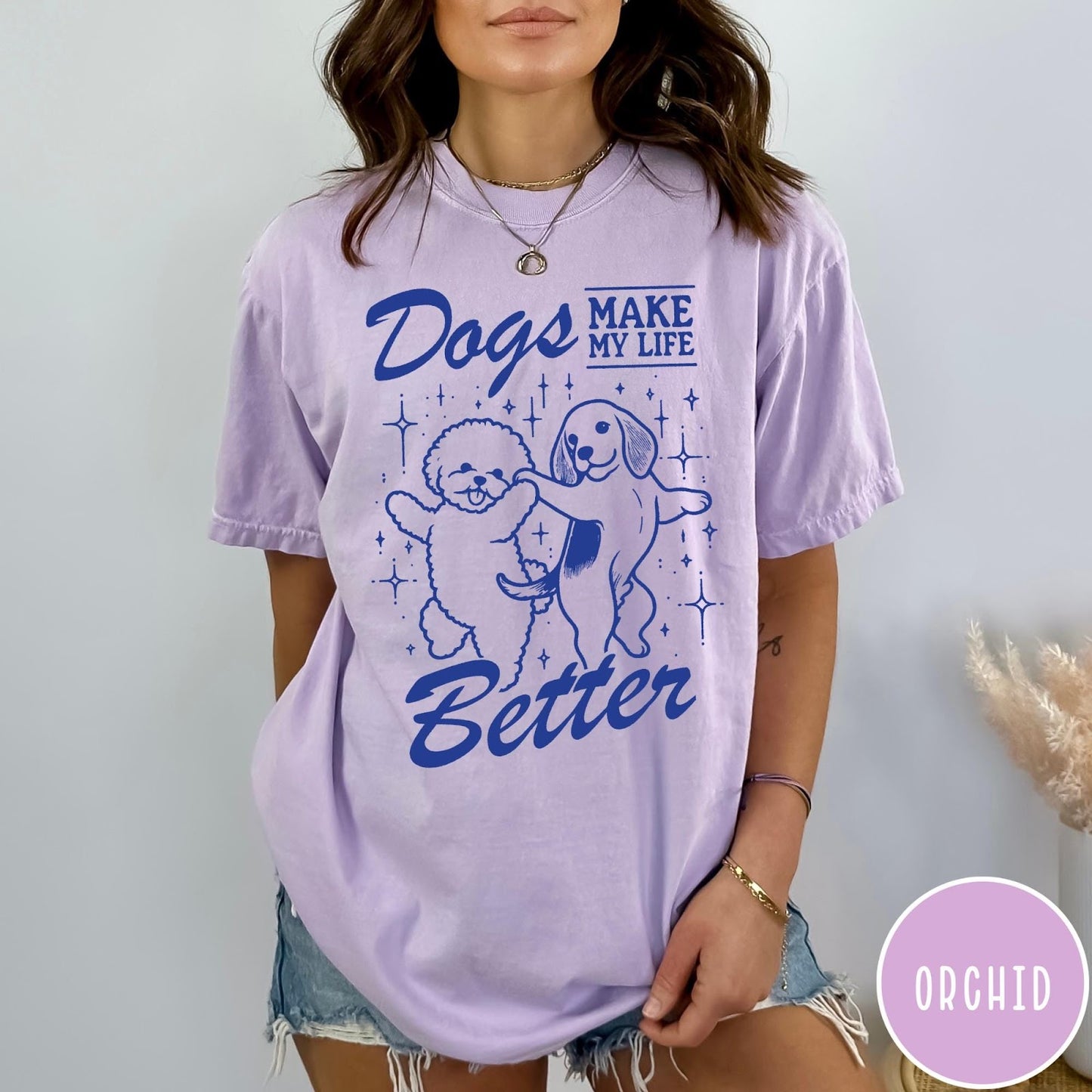 Comfort Colors tee in Orchid featuring line art graphic of two dogs dancing with stars and text