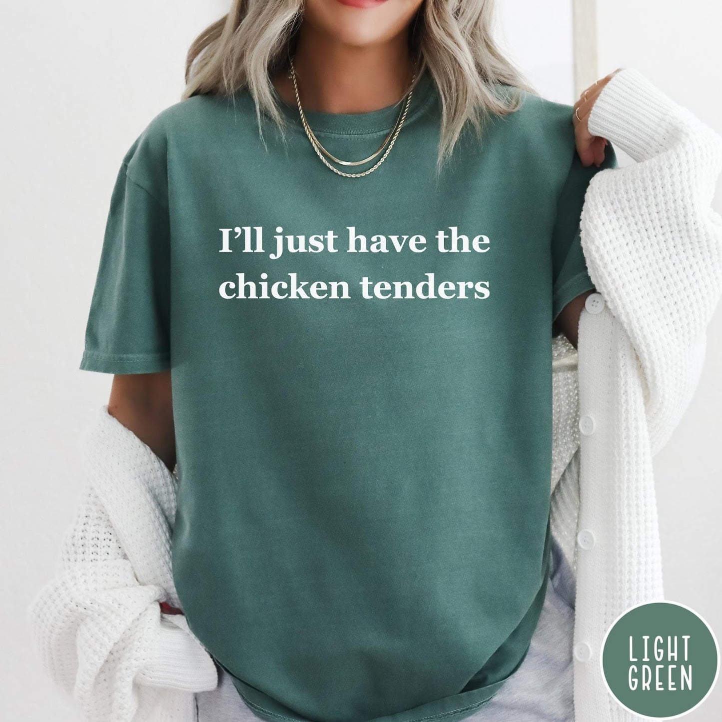 Comfort Colors tee in Light Green featuring food style graphic text that reads I'll just have the chicken tenders