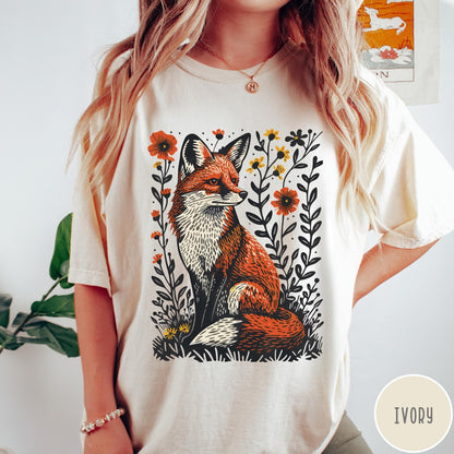Comfort Colors tee in Ivory featuring vintage style graphic of a sitting fox surrounded by orange flowers