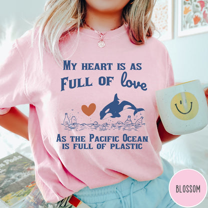 Comfort Colors tee in Blossom featuring screen printed orca and plastic pollution graphic with ocean conservation text