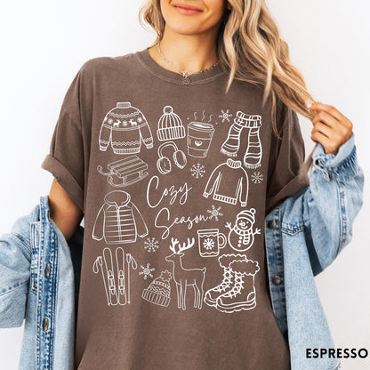 Comfort Colors tee in Espresso featuring line art winter activities and seasonal items graphic design