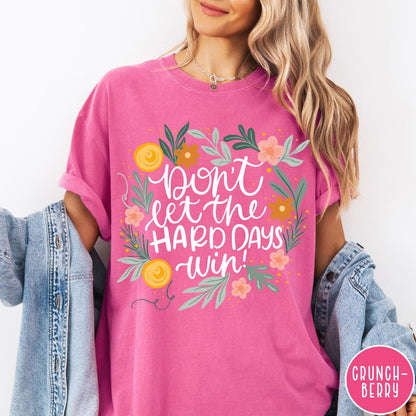 Comfort Colors tee in Crunchberry featuring floral mental health encouragement graphic with the text Don't Let The Hard Days Win