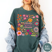 Comfort Colors tee in Blue Spruce featuring floral wildflowers design with Happiness Blooms Within text graphic description