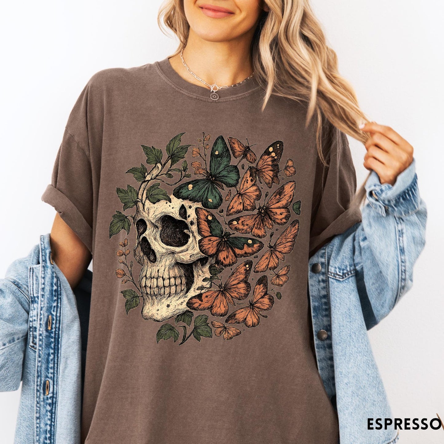 Comfort Colors tee in Espresso featuring vintage style graphic with a skull surrounded by various colorful butterflies