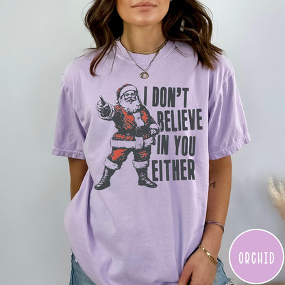 Comfort Colors tee in Orchid featuring vintage style Santa Claus graphic with text I Don't Believe In You