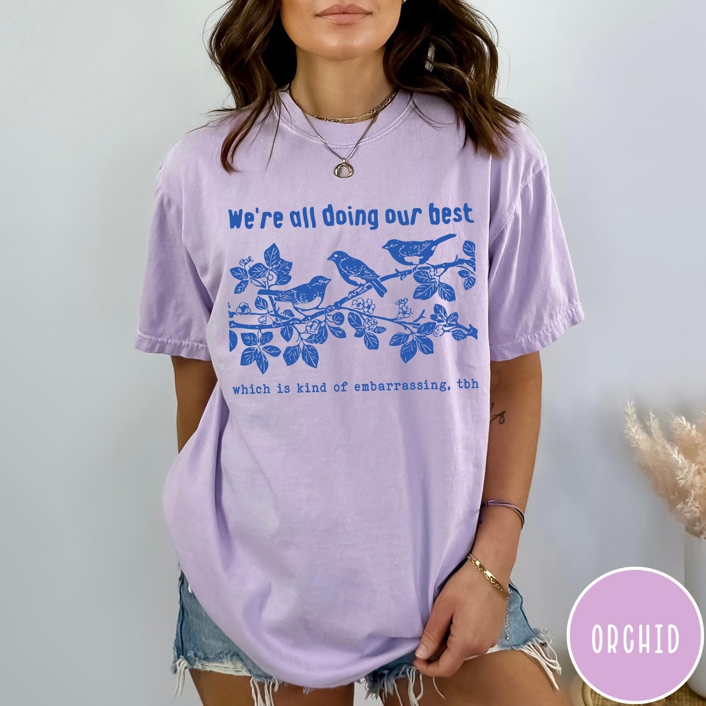 Comfort Colors tee in Orchid featuring graphic illustration of birds on a branch with text.