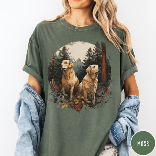 Comfort Colors tee in Moss featuring vintage style graphic of two golden labrador dogs in a forest