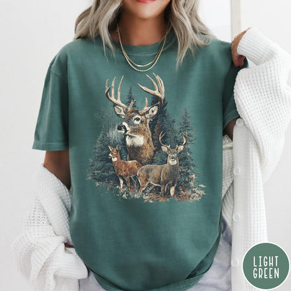 Comfort Colors tee in Light Green featuring vintage style graphic of a deer family in a forest scene