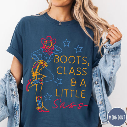 Comfort Colors tee in Midnight featuring retro cowgirl design with boots and text Boots, Class & A Little Sass