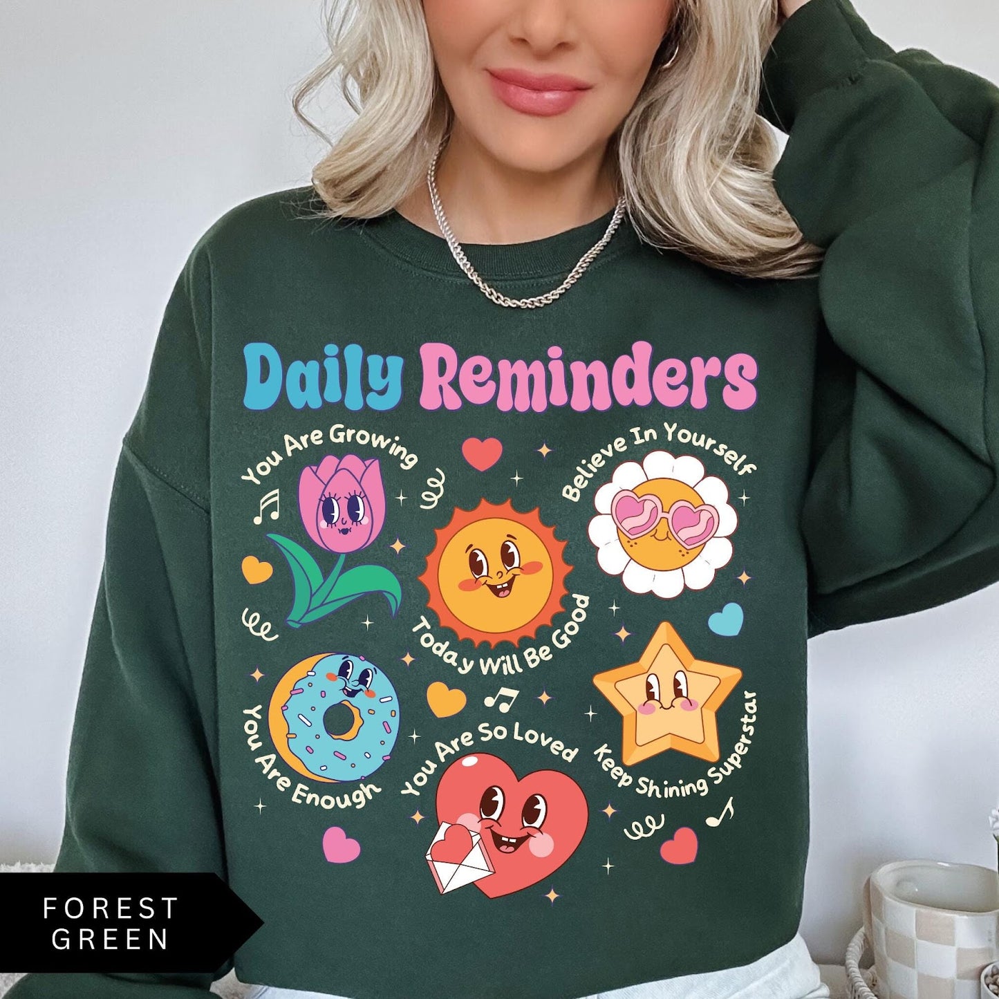 Comfort Colors tee in Forest Green featuring retro mascot design with daily affirmations and colorful graphics