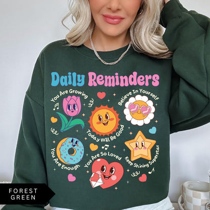 Comfort Colors tee in Forest Green featuring retro mascot design with daily affirmations and colorful graphics