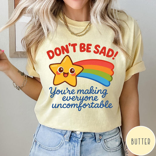 Comfort Colors tee in Butter featuring cute shooting star graphic with Don't Be Sad text