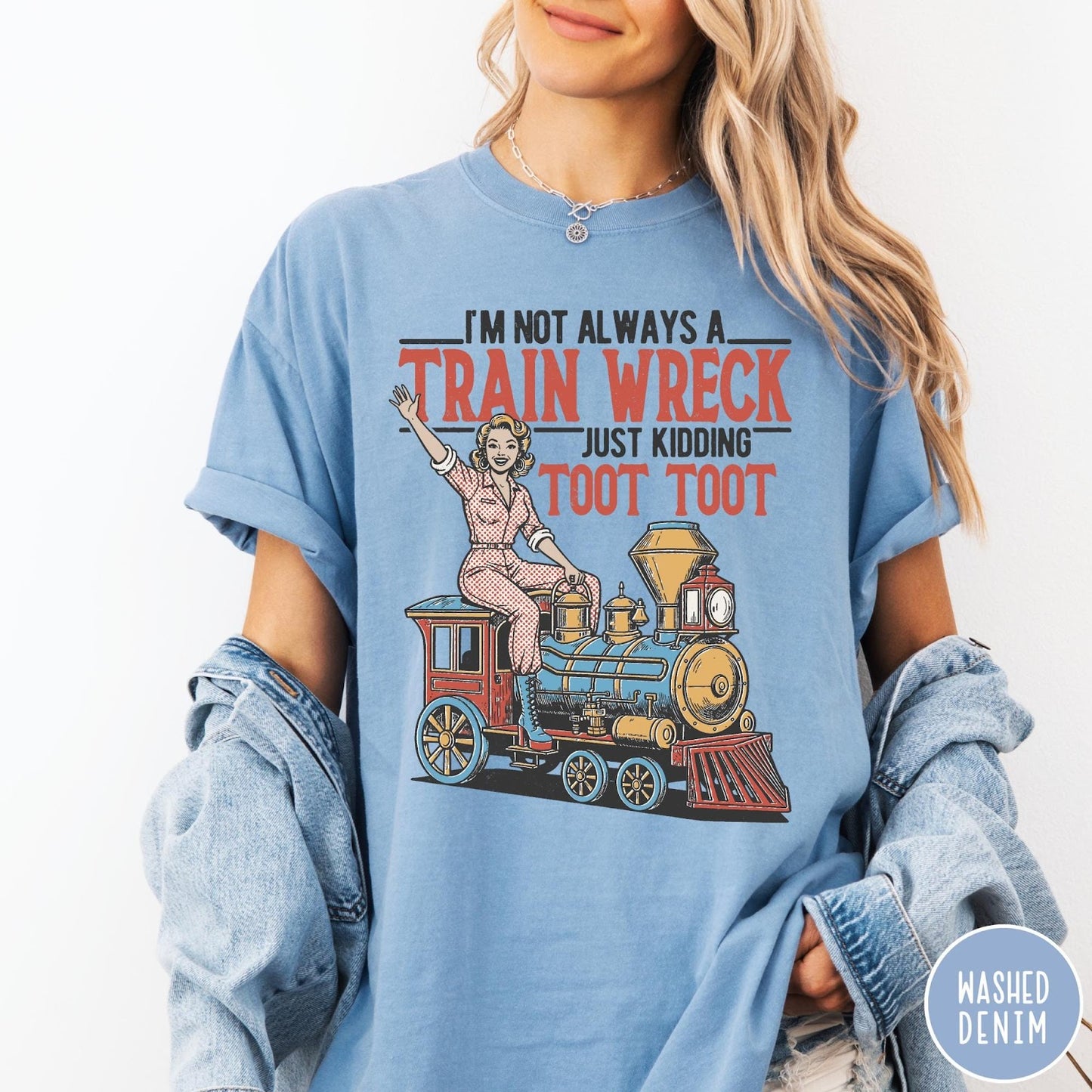 Comfort Colors tee in Washed Denim featuring vintage pin-up style graphic of a woman riding a steam train