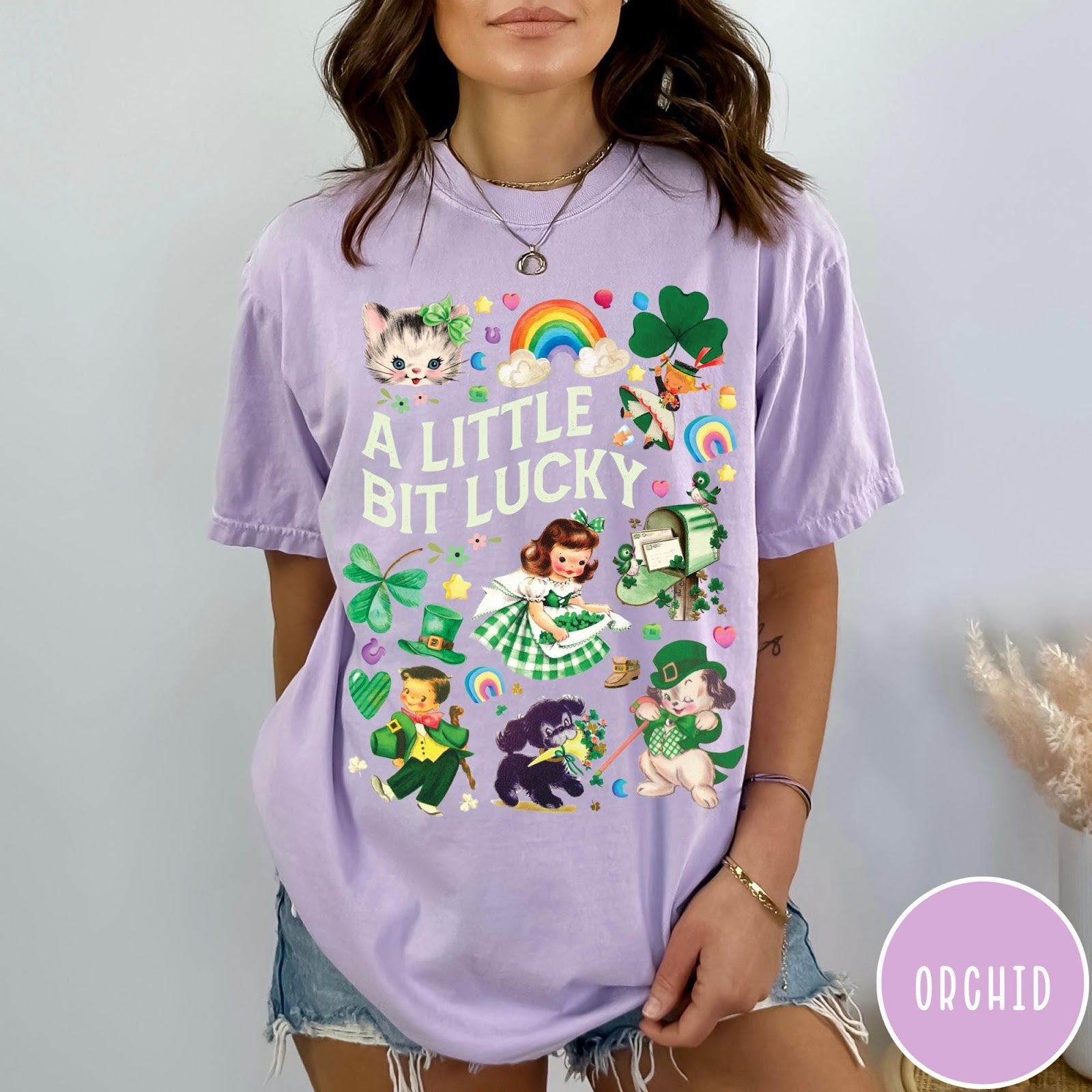 Comfort Colors tee in Orchid featuring St. Patrick's Day collage with vintage characters and lucky symbols
