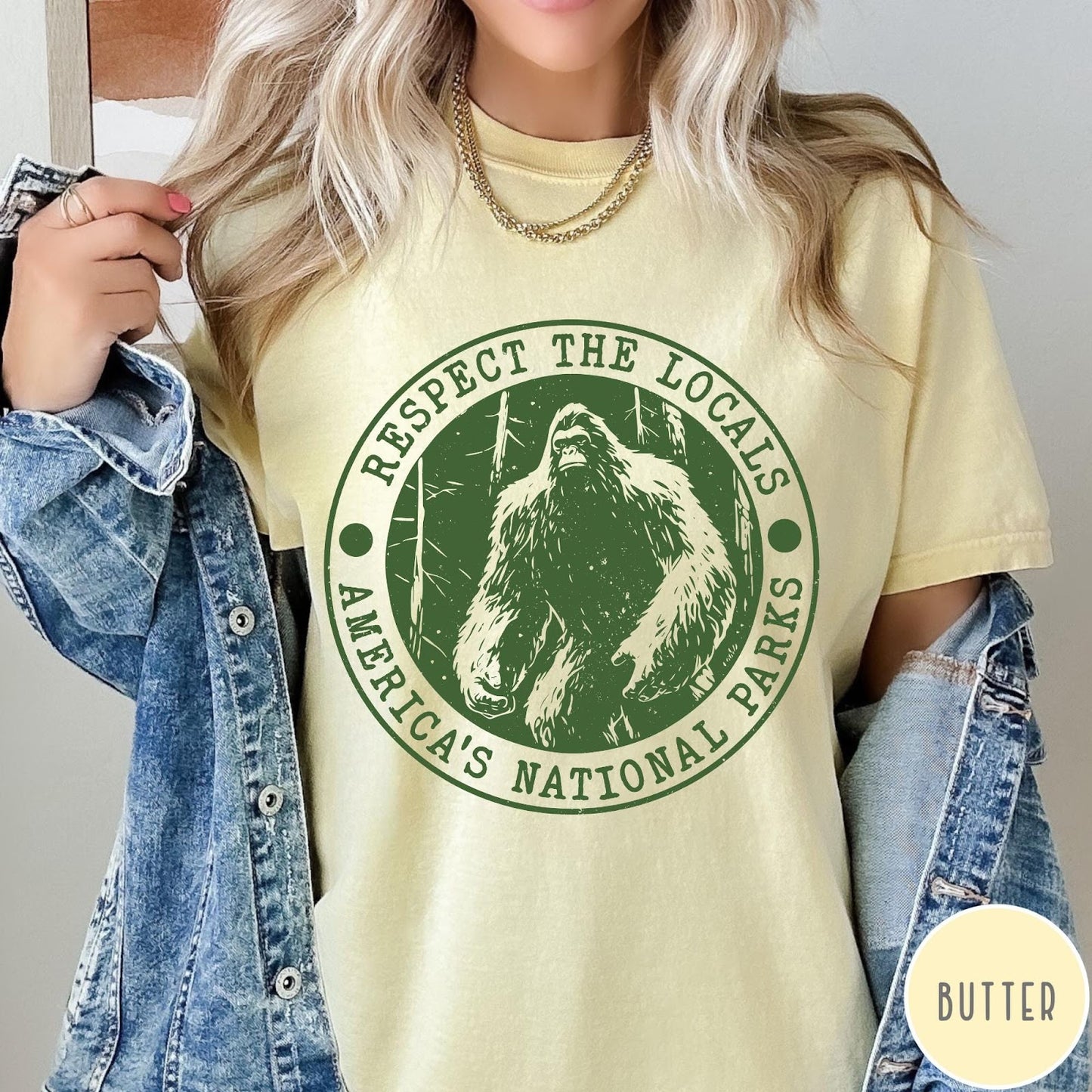 Comfort Colors tee in Butter featuring circular graphic design with Bigfoot and Respect the Locals text