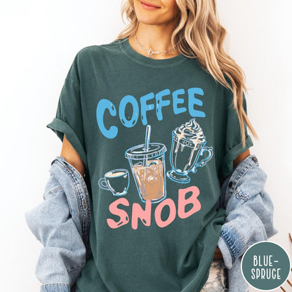 Comfort Colors tee in Blue Spruce featuring illustrated coffee graphic with iced coffee, hot coffee, and whipped cream.