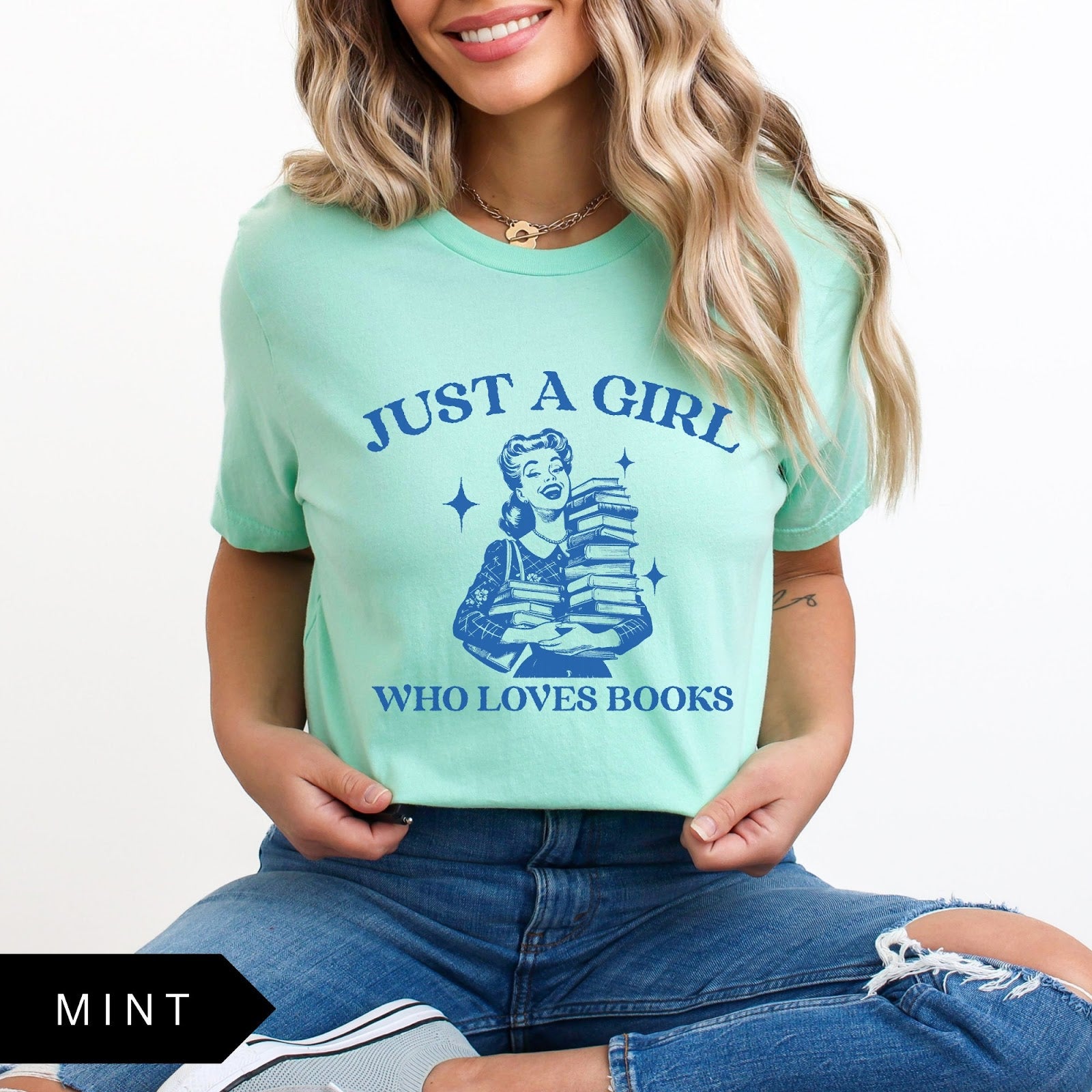 Comfort Colors tee in Mint featuring vintage style graphic of a girl holding a stack of books